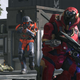 A Spartan aims a pistol at another Spartan on the Live Fire map in Halo Infinite.